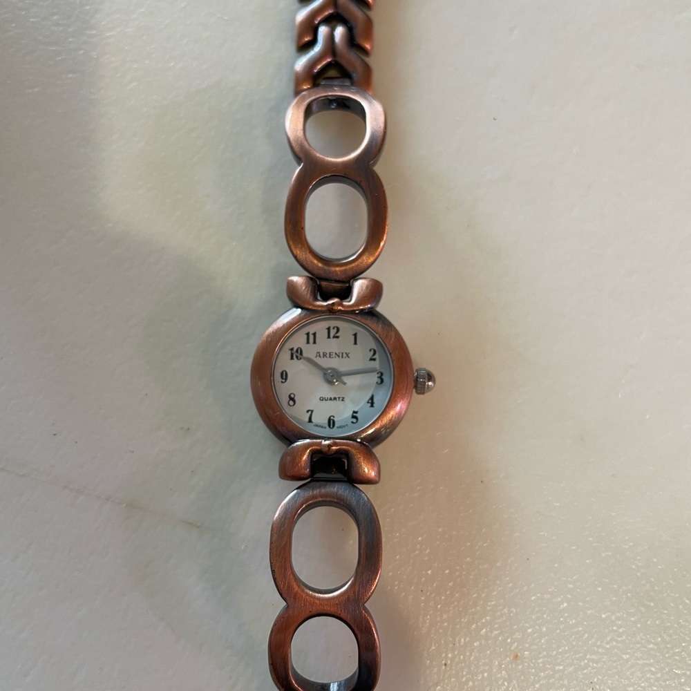 Arenix bronze colored watch. Gently used. Needs a battery